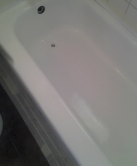 New surface Chemically bonded onto the bathtub by Dallas Bathtub Services in Dallas TX.