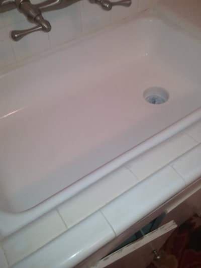 Dallas Bathtub Services bonded a new surface onto the sink preventing replacement.